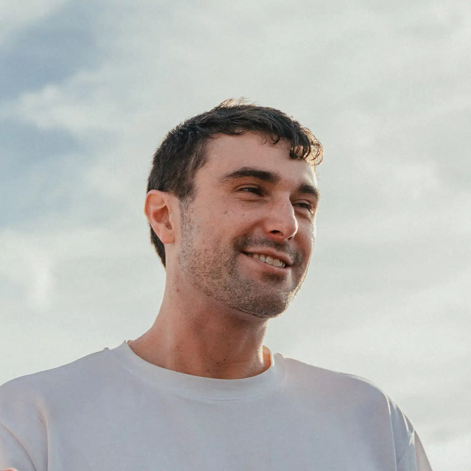 Image shows photo of Fred Again in white t-shirt