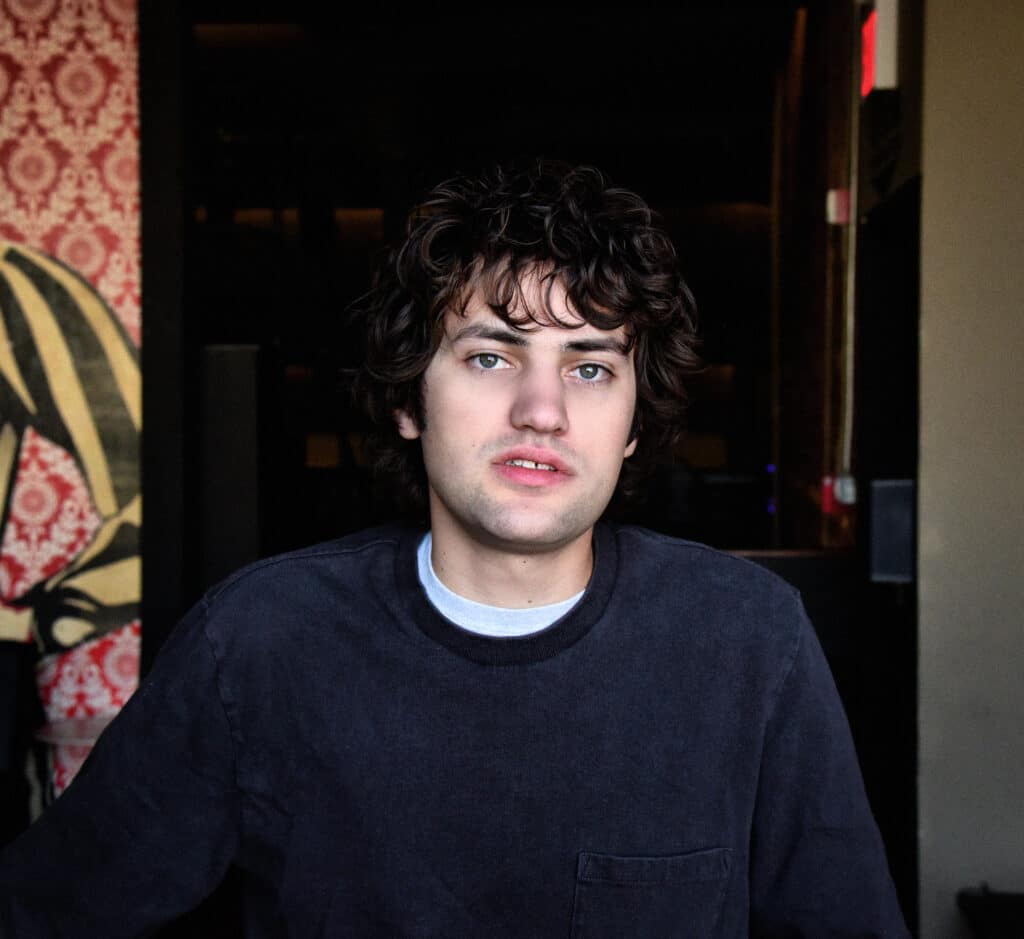 MJ Lenderman looks directly at the camera for press shot