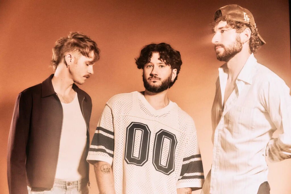 The Band CAMINO pose in a moody promotional shot ahead of their NeverAlways world tour and latest single release 12:34.